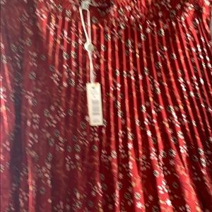 Rust colored pleated midi skirt with small print